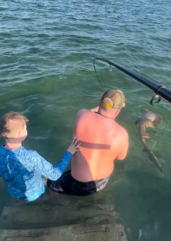 Trying to get a nurse shark off the line.