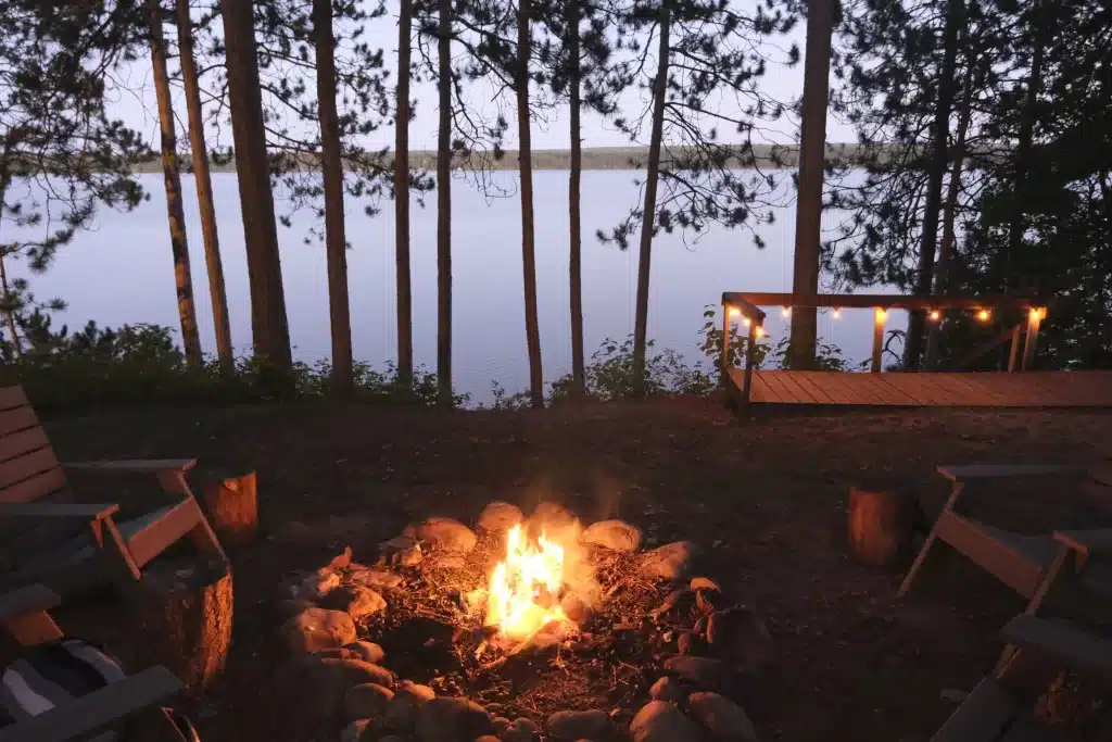 Enjoy lakeside campfires in this VRBO. 